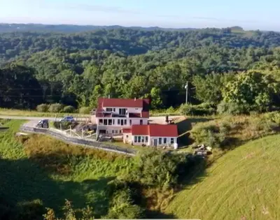 an aerial view of a house on a hill at Aniyor Apartment Loft