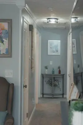 a hallway with a hallway leading to a living room at Huber Heights Home w/Hot Tub near Rose Music/WPAFB in Dayton