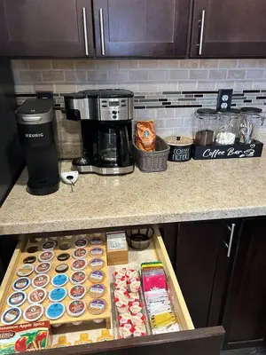 a counter with boxes of pastries and a coffee maker at Huber Heights Home w/Hot Tub near Rose Music/WPAFB in Dayton