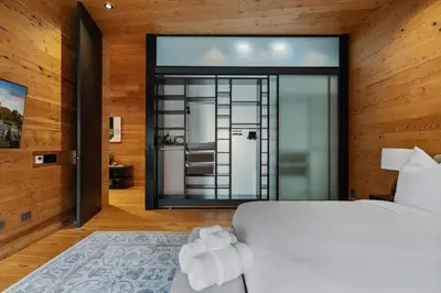 a bedroom with a bed and a large window at Cincinnati Vista - Rooftop, Balcony & Fireplace in Cincinnati