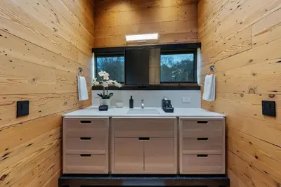 a bathroom with a sink and a mirror at Cincinnati Vista - Rooftop, Balcony & Fireplace in Cincinnati