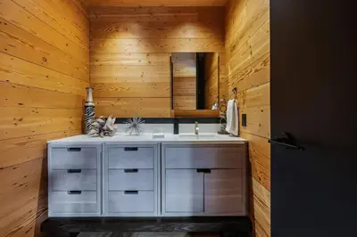 a bathroom with a white sink and a mirror at Cincinnati Vista - Rooftop, Balcony & Fireplace in Cincinnati
