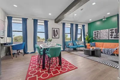 a dining room and living room with a table and chairs at Stunning 2BR-1B Apt+Mins to Zoo& D/T+HD Projector in Cleveland