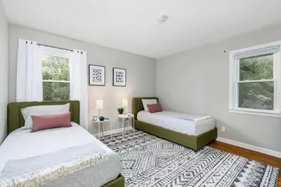 a bedroom with two beds and a rug at Bexley Breeze | High-Speed Wi-Fi | King Bed in Bexley