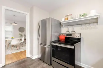 a kitchen with a stove and a refrigerator at Bexley Breeze | High-Speed Wi-Fi | King Bed in Bexley