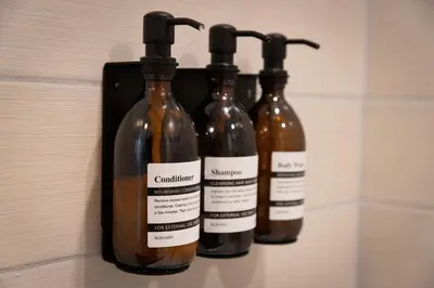 three bottles of wine hanging on a wall at Blissful Serenity - Walk to Lake Milton with Hot Tub in Lake Milton