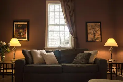 a living room with a couch and a window at Clifford House Private Home B&B in Cleveland
