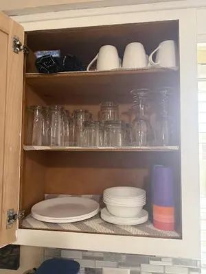 a cupboard filled with plates and bowls and glasses at Akron 2 Bed 1 Bath Mountain Oasis Dog Friendly in Akron