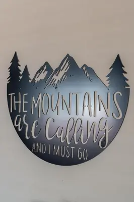 a sign that reads the mountains are calling and i must go at Akron 2 Bed 1 Bath Mountain Oasis Dog Friendly in Akron