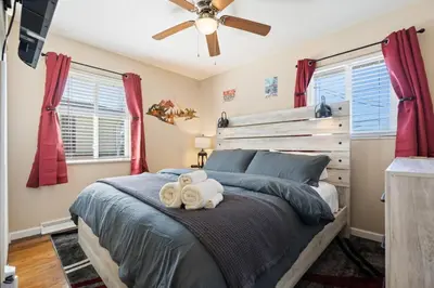 a bedroom with a bed with two towels at Akron 2 Bed 1 Bath Mountain Oasis Dog Friendly in Akron