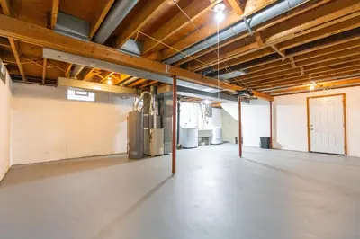 a large room with an empty floor in a building at Akron 2 Bed 1 Bath Flight Themed Oasis Dog Friendly in Akron
