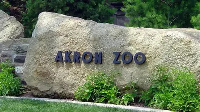 a rock with a sign that says avon on it at Akron 2 Bed 1 Bath Flight Themed Oasis Dog Friendly in Akron