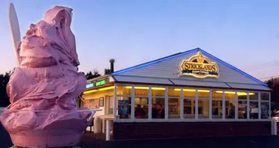 a restaurant with a ice cream cone in front of it at Akron 2 Bed 1 Bath Flight Themed Oasis Dog Friendly in Akron