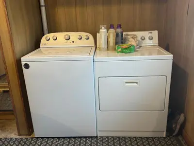 a small white stove and a small white refrigerator at Muncie 3 bedroom 2 bath brick home in Muncie