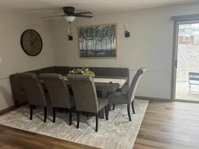 a dining room with a table and chairs at Muncie 3 bedroom 2 bath brick home in Muncie