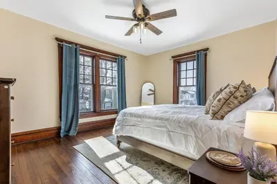 a bedroom with a bed and a ceiling fan at The Hazelton in Downtown Lancaster's Historic District in Lancaster