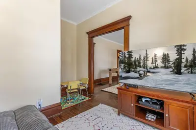 a living room with a mirror and a couch at The Hazelton in Downtown Lancaster's Historic District in Lancaster