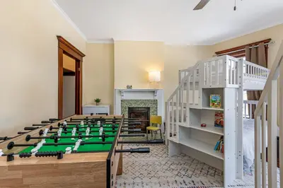 a room with a foosball table in the middle at The Hazelton in Downtown Lancaster's Historic District in Lancaster