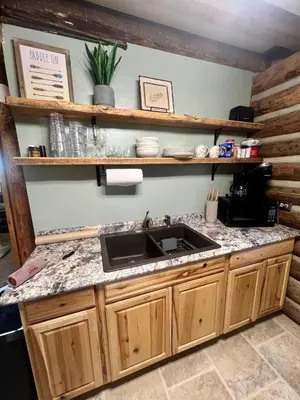 a kitchen with a sink and a counter top at Walnut Creek Cabin in Chillicothe