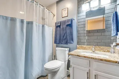 a bathroom with a toilet and a sink and a shower at Castlerea Casa! Columbus Area Home with Yard in Hilliard