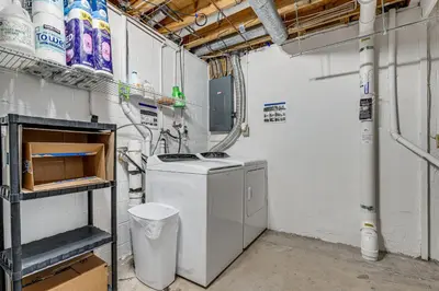 a laundry room with a washing machine in it at Castlerea Casa! Columbus Area Home with Yard in Hilliard