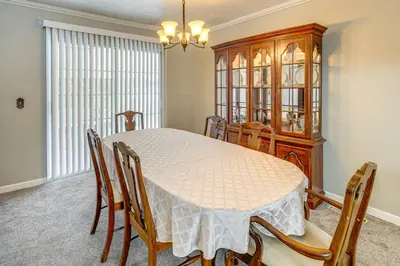 a dining room with a table and chairs at half Mi to Kanawha River Quiet Escape with Patio in Chesapeake