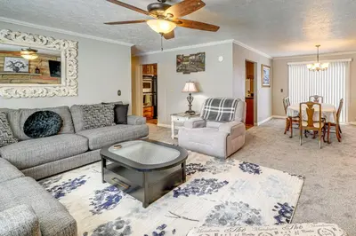 a living room with a couch and a table at half Mi to Kanawha River Quiet Escape with Patio in Chesapeake