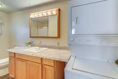 a kitchen with a sink and a mirror at half Mi to Kanawha River Quiet Escape with Patio in Chesapeake