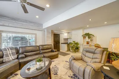 a living room with a couch and a table at Pool Table and Private Porch Peaceful Apt in Belle in Chesapeake