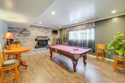 a room with a pool table and a fireplace at Pool Table and Private Porch Peaceful Apt in Belle in Chesapeake