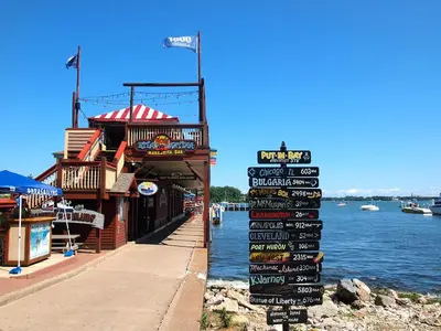 a sign for a seafood restaurant next to the water at Put-in-Bay Island Club #12 in Put-in-Bay