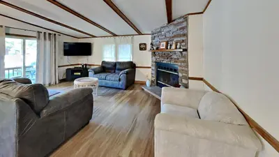 a living room with a couch and a fireplace at Put-in-Bay Island Club #12 in Put-in-Bay