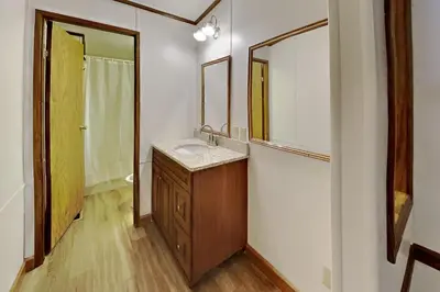 a bathroom with a sink and a mirror at Put-in-Bay Island Club #12 in Put-in-Bay