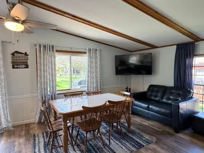 a living room with a table and a couch at Put-in-Bay Island Club #63 in Put-in-Bay