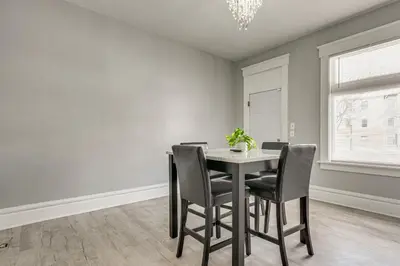 a dining room with a table and chairs at Walk to Trolley District Olde Towne East Retreat in Columbus