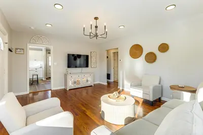 a living room with white furniture and a tv at Stay in the Heart of London! Walkable, Modern Home in London