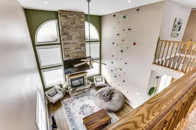 an indoor gym with a rock climbing wall at Family Home on 9 Acres! Climbing Wall and Gym in Thornville