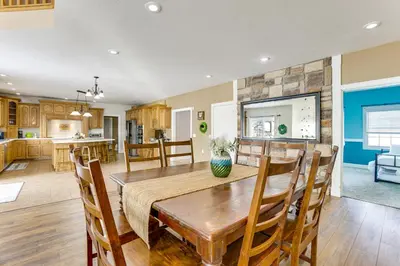 a dining room and kitchen with a table and chairs at Family Home on 9 Acres! Climbing Wall and Gym in Thornville