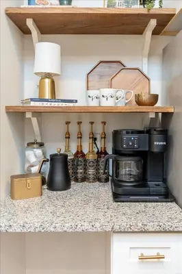a kitchen counter with a coffee maker and a microwave at 4 mins to Convention Center-Street Parking in Columbus