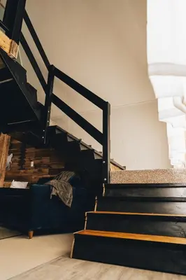a set of stairs in a building at The Rustic Triangle A-Frame in Perrysville