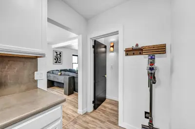 a kitchen with a door leading to a bedroom at Modern Stylish Urban Haven 4 Bedroom 2 Bath - Dog Friendly in Akron