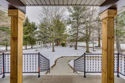 a gate in a park with snow on the ground at Willard Home On Working Farm with Water Views! in Willard