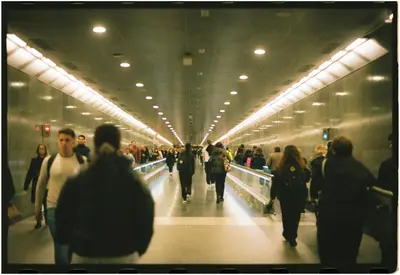 a crowd of people walking in a subway station at Rooms for Rent in Cleveland