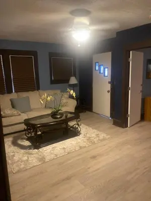 a living room with a couch and a coffee table at Rooms for Rent in Cleveland