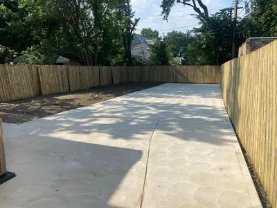 a sidewalk in front of a wooden fence at Rooms for Rent in Cleveland