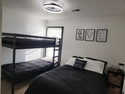 a bedroom with two bunk beds and a window at Port Clinton Paradise- Waterfront 2 bedroom, Pool, Hot tub, Sauna, Fire pit in Port Clinton