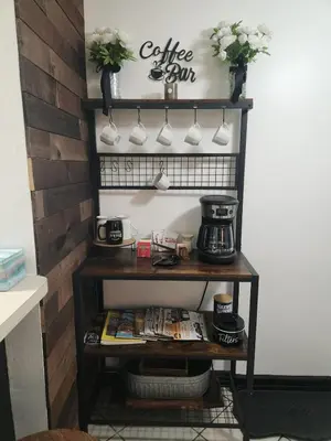 a coffee shop shelf with coffee mugs on it at Port Clinton Paradise- Waterfront 2 bedroom, Pool, Hot tub, Sauna, Fire pit in Port Clinton