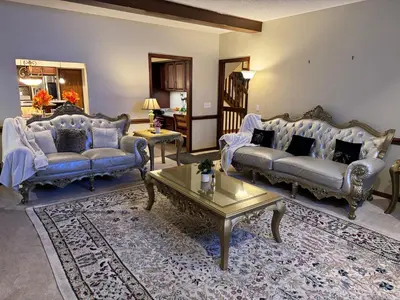 a living room with two couches and a coffee table at Luxury 5BR Estate: Media Room & Golf | Sleeps 14 in Sylvania