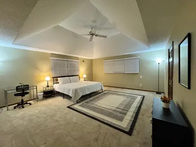 a large bedroom with a bed and a ceiling at Luxury 5BR Estate: Media Room & Golf | Sleeps 14 in Sylvania