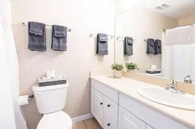 a bathroom with a toilet and a sink at Downtown 2BR | Walk to Venues, Play house Square in Cleveland
